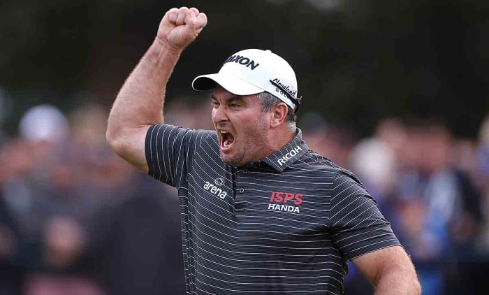 Ryan Fox of New Zealand celebrates as he holes the winning putt on the 18th green at the 2023 BMW PGA Championship.